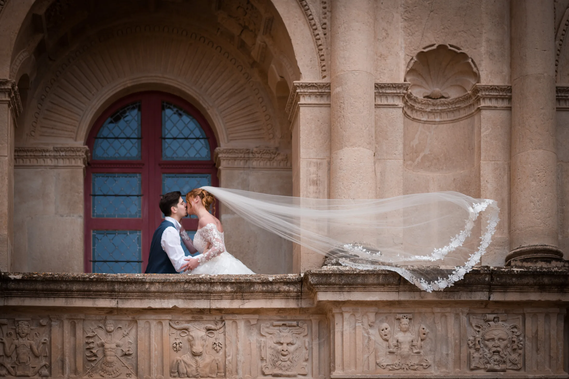 The bride’s veil flying from the loggia
