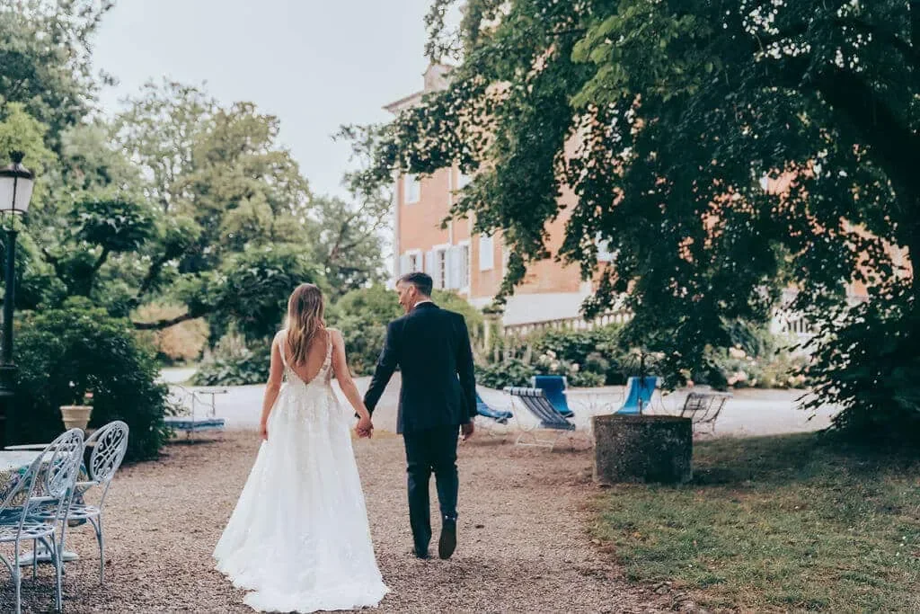 A couple walking down the park alley