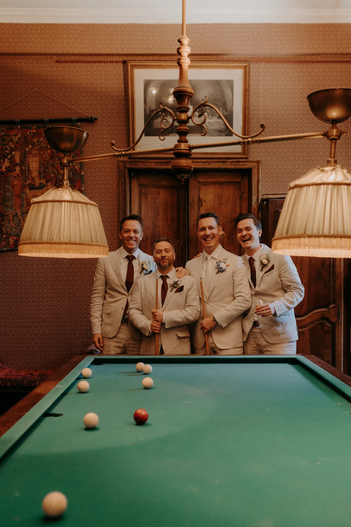 Friends of the groom around the billiard table of the château
