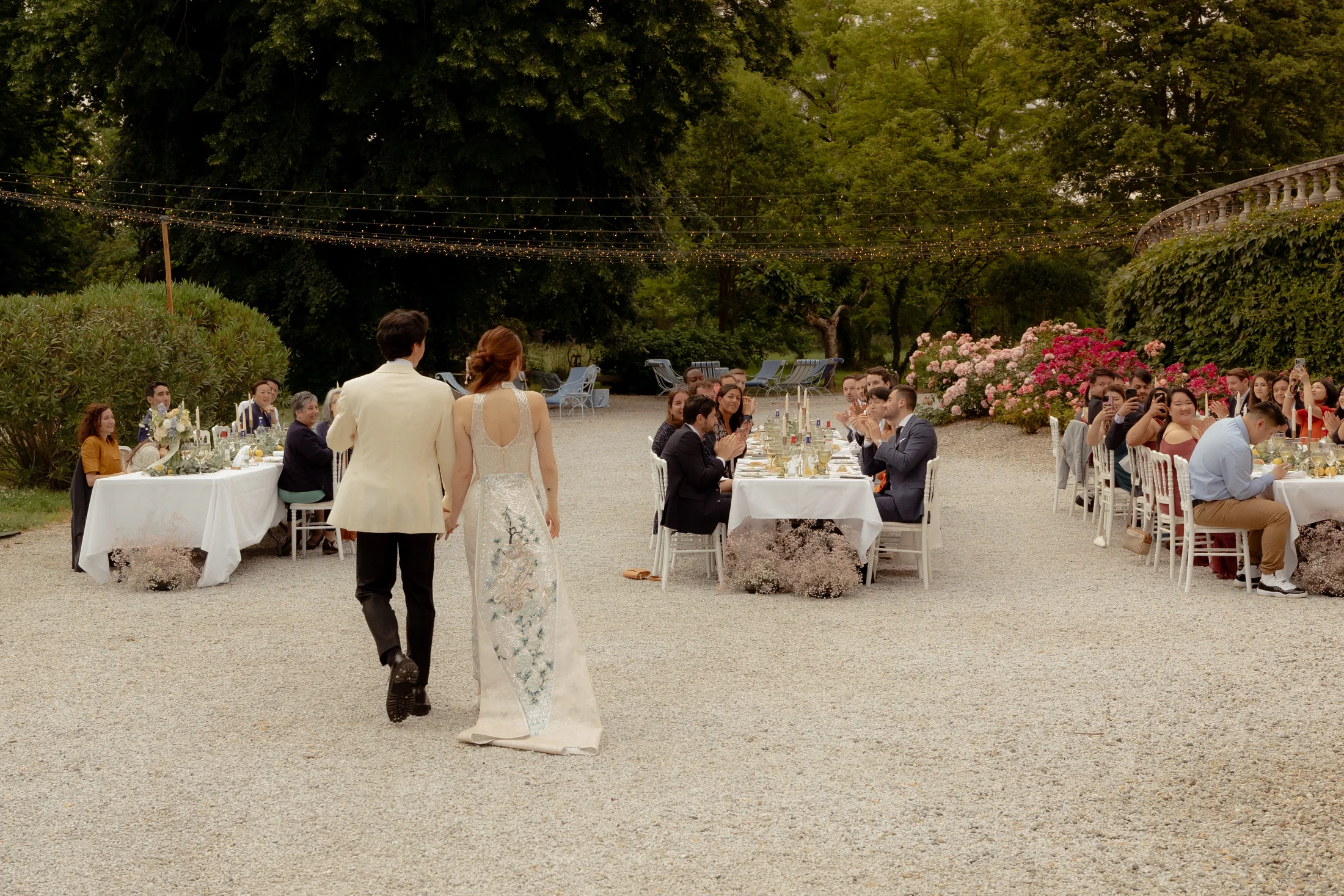 Guests at dinner along the alley of the park