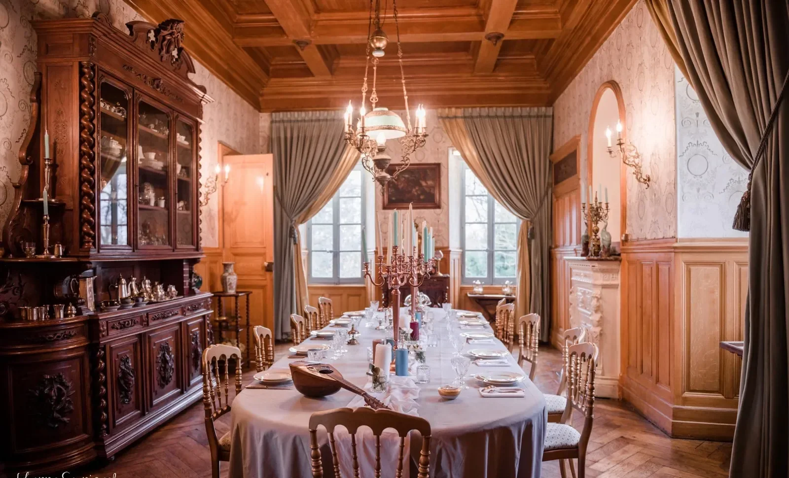 A private dinner table under a chandelier