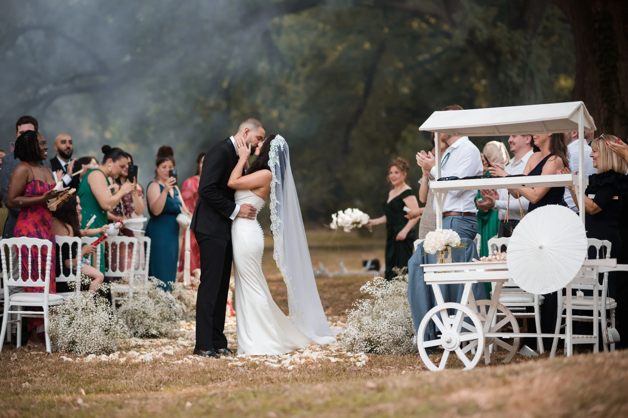 The newlyweds’ kiss at the end of the ceremony in the park