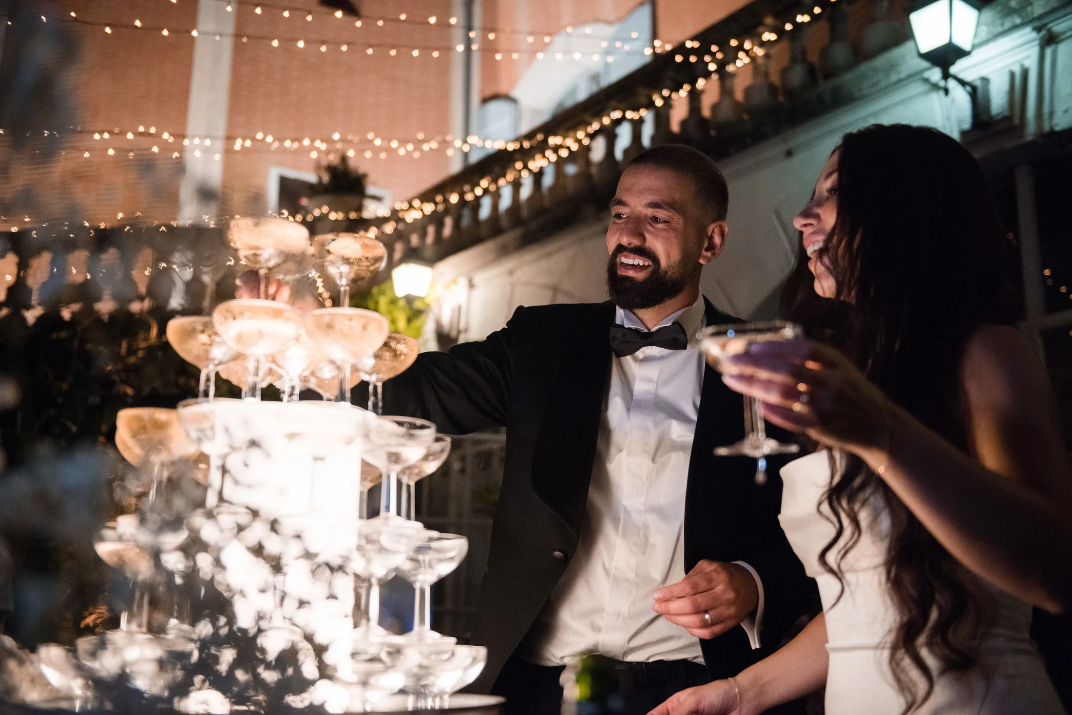 The champagne tower under the strings of light
