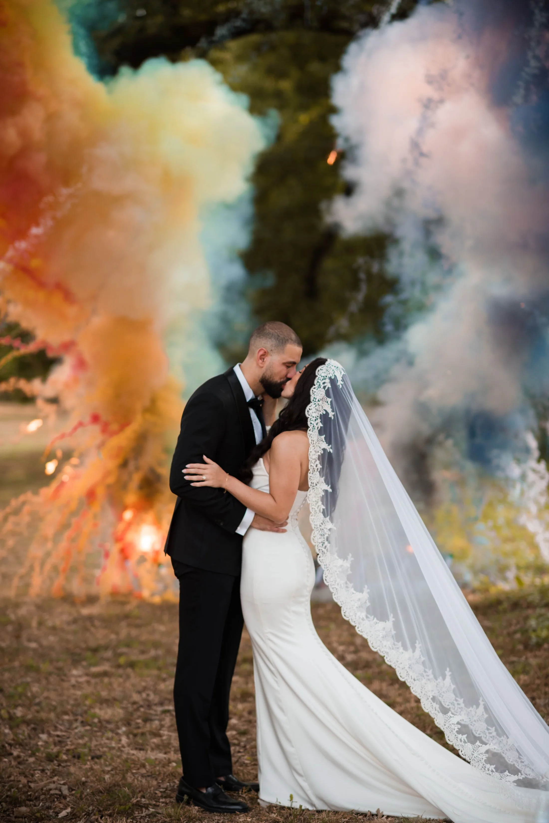 The newlyweds in a cloud of coloured smoke